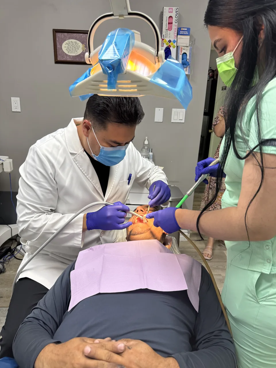 Dentist at Latino Americano Dental treating a patient in San Jose