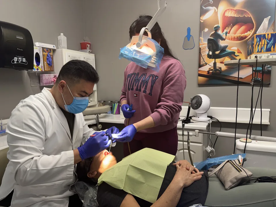 Dentist at Latino Americano Dental treating a patient at the office